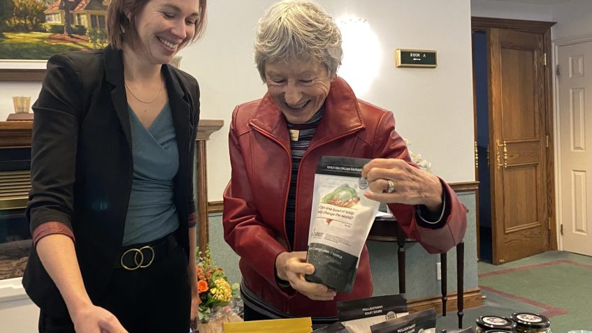 Raw Carrot community engagement manager Elena Haskell and St. Andrew's Barrie's Penny Barker restock the sales table and talk about the seasonal flavours of the heart-warming soups.